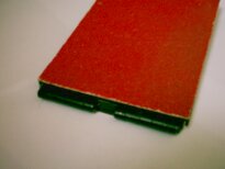 The front wall of the switch. A tiny piece of cuprextite fills the gap between the hinges